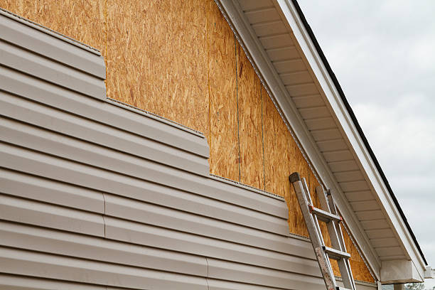 Professional Storm Damage Siding Repair technician working in Wake Forest, NC